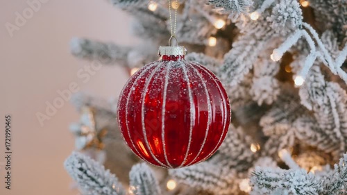 Frosted Christmas tree glowing lights red ornament, festive holiday background, cozy winter decoration, New Year celebration detail, sparkling seasonal decor, traditional Xmas mood, joyful festive 