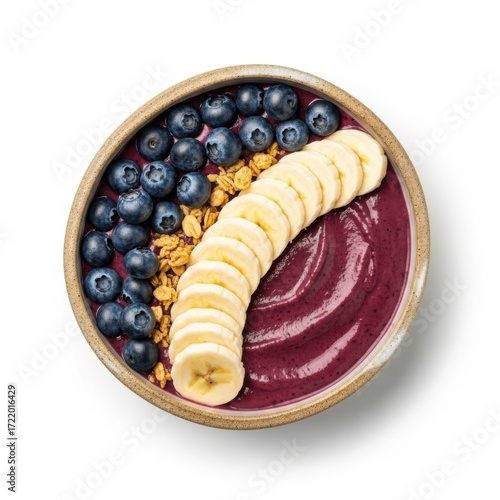Delicious açaí bowl topped with fresh blueberries granola and sliced banana