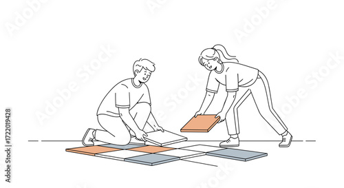 Smiling couple laying tiles together