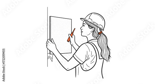 Woman marking measurements on a wall, woman installing decorative panels