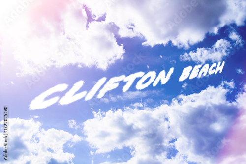 Resort in clifton beach. Tourists at resorts. Inscription in sky..