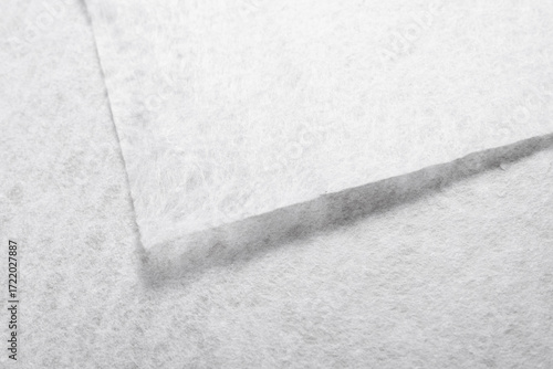White Geotextile Fabric Sheets with Visible Texture, Close-Up