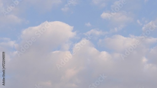 Beautiful White Cumulonimbus Fluffy Clouds Moving on the Sky. Clouds in a Slideshow on the Sky in a Summer Day.