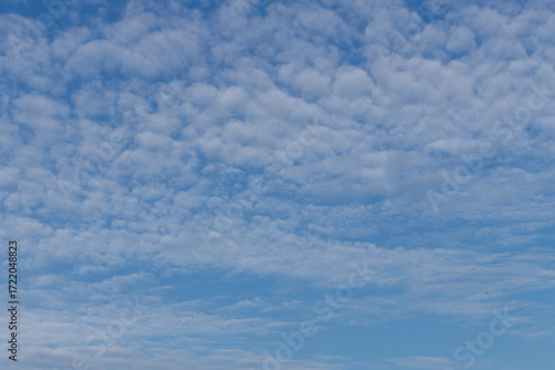 Clear Blue Sky With Soft Clouds Over a Calm Day, Bright Open Atmosphere for P...