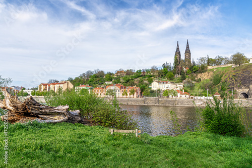 Church of St. Peter and St. Paul in Vysehrad, Prague. Neo-Gothic basilica with twin spires, historic cemetery and city views. Iconic Czech landmark for travel and history photos.