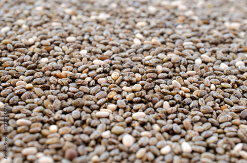 Heap of chia seeds as background, texture, above. Pile of healthy chia seeds, background, texture, close-up. Heap of chia seeds close-up, background, texture, top view.