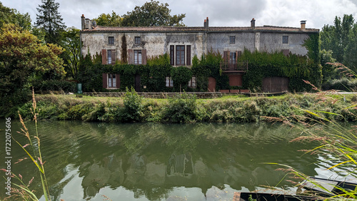 Canal with Old House in Coulon, Marais Poitevin, France. 