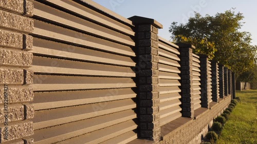 decorative brick and metal fence