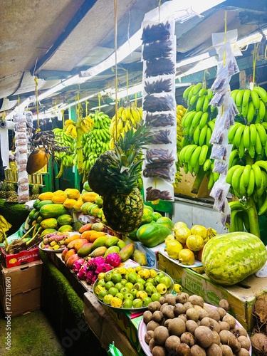 Banana and vegetable shops in Salalah, Oman, displaying fresh local produce during Khareef season, showcasing market culture, agriculture, food trade, and vibrant street life.