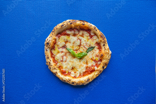 Classic Margherita Neapolitan Pizza on Blue Background