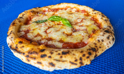 Classic Margherita Neapolitan Pizza on Blue Background