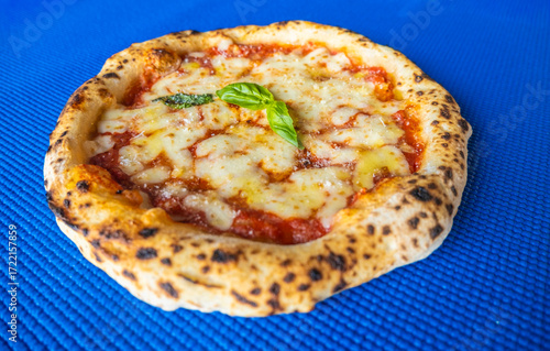 Classic Margherita Neapolitan Pizza on Blue Background