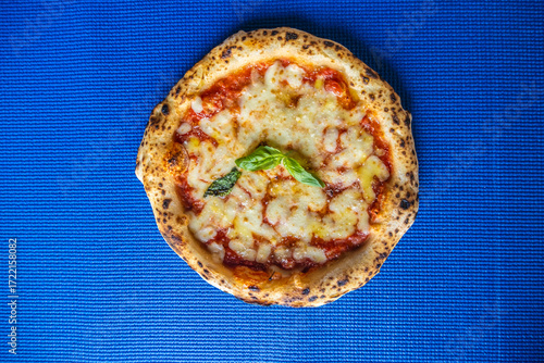 Classic Margherita Neapolitan Pizza on Blue Background