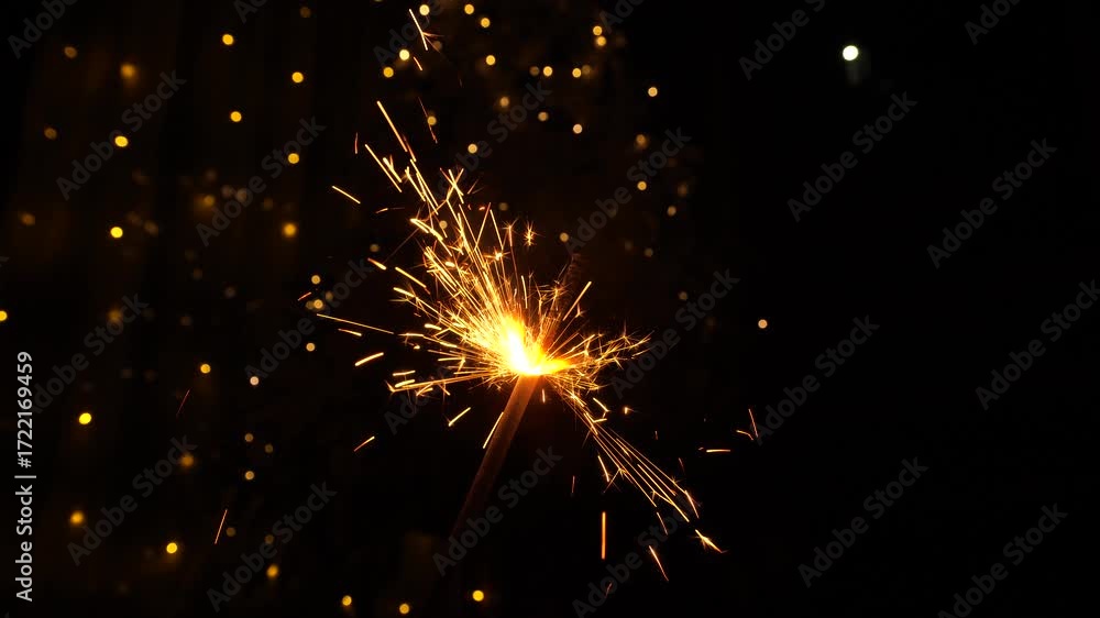 Christmas sparklers candle burns in Christmas tree background. Celebration, Success, New Years Concept.