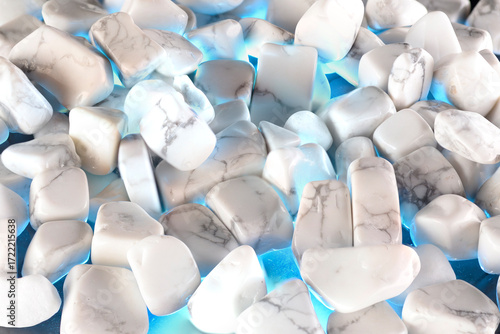 White polished stones texture background and blue light
