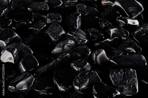 Black polished stones texture background