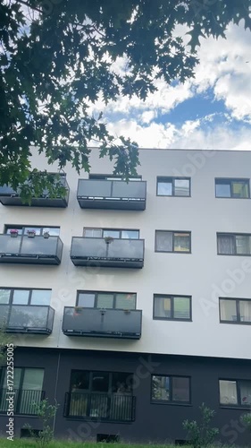 Urban architecture and modern residential infrastructure. Facade of a multi-storey apartment building. Real estate.