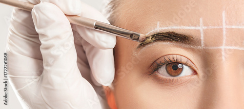 Young woman undergoing eyeb...