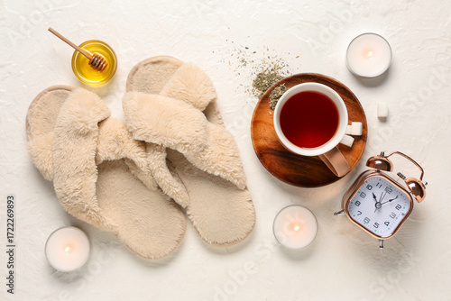 Slippers, alarm clock, cand...