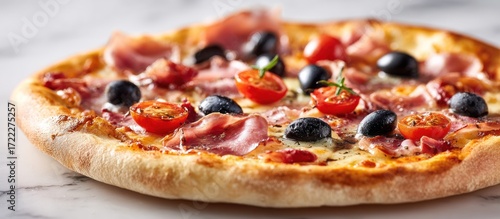 A close-up view of a fresh pizza with toppings, on a white marble surface