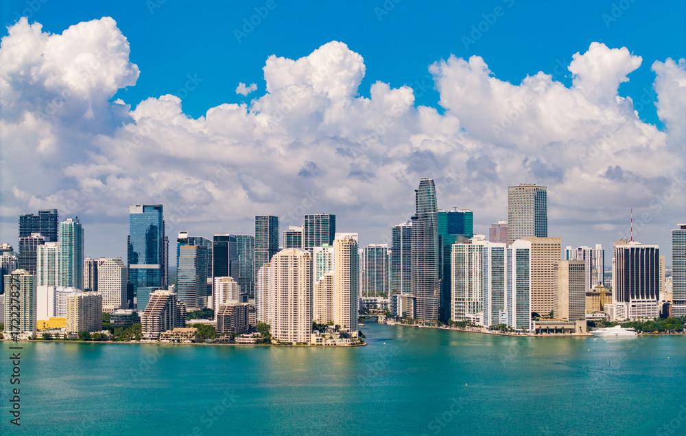 Obraz premium Aerial view of Brickell skyline in downtown Miami. Modern skyscrapers rise above Biscayne Bay. Miami Urban landscape with iconic buildings. Miami cityscape.