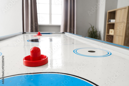 Modern air hockey in living...