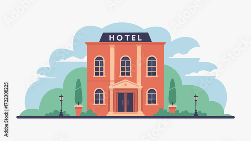 A classic brick hotel building with a sign, trees, and streetlights in front.