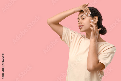 Young woman applying skinca...