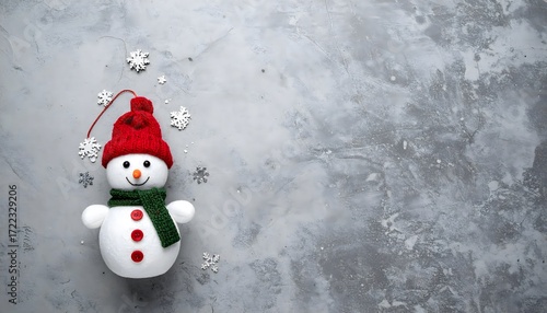  The simple, modern composition against a minimalist gray concrete background offers a unique and fresh take on a classic Christmas theme.