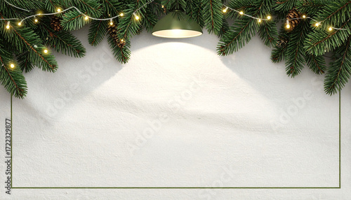 A single lamp shines down on a textured white background with a green frame, creating an inviting and well-lit space for a holiday message.