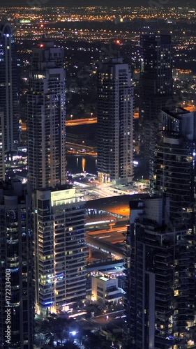 Wallpaper Mural A stunning night cityscape featuring illuminated towers soaring high into the night sky Torontodigital.ca