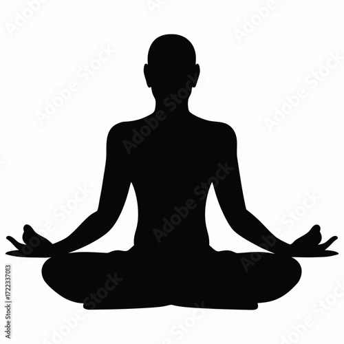 Silhouette of a person meditating in a lotus pose