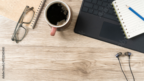 Modern work from home essentials flatlay offers a cozy, productive vibe for your next project showcasing technology, planning, and relaxation elements