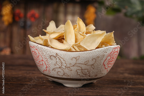 Dried Lily Bulb Petals Chinese Herbal Medicine in Traditional Porcelain Bowl