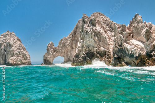 Seascape with the Cabo San Lucas arch and waves breaking on the mountains in the Pacific Ocean, finisterra, Baja California Sur MEXICO
