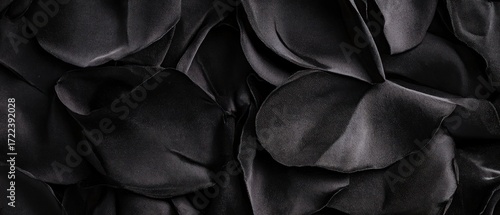Textured black fabric dark monochromatic ruffled surface background