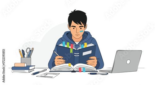 Focused Male Student Studying with Books and Laptop