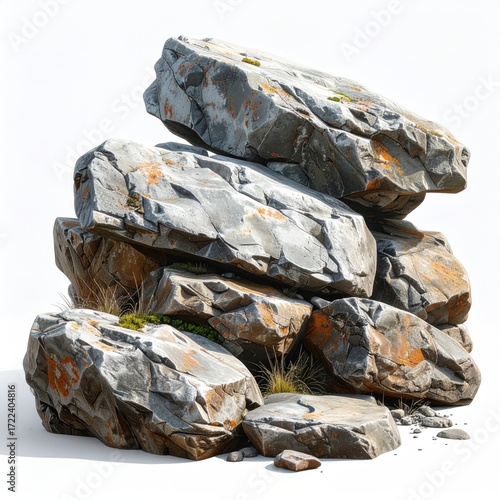 A stack of flat, gray rocks rests against a white background. Patches of orange and green dot their surfaces, with dry grass scattered about