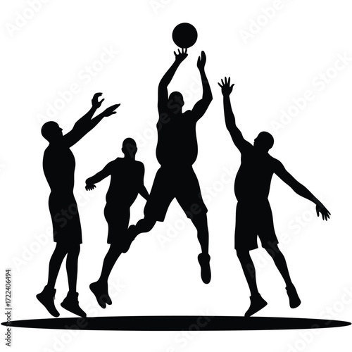 Silhouettes of basketball players in a dynamic game moment