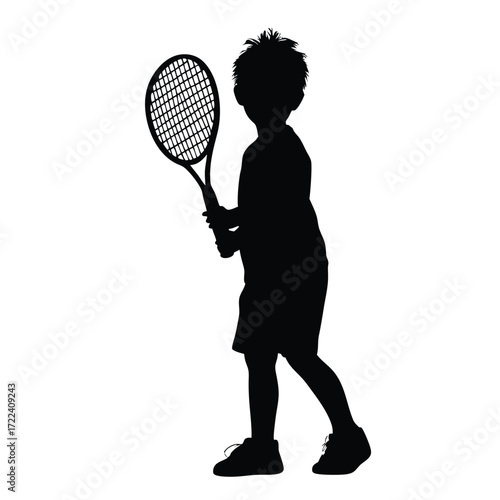 Silhouette of a young tennis player holding a racquet in action