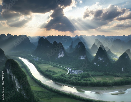 Breathtaking landscape featuring dramatic mountains and a winding river at sunset.