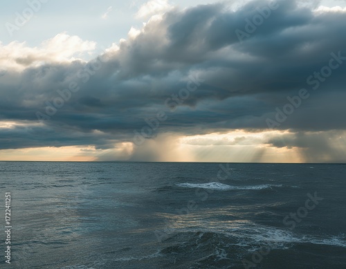 Dramatic skies over a tranquil ocean at dusk, capturing the essence of nature's beauty.