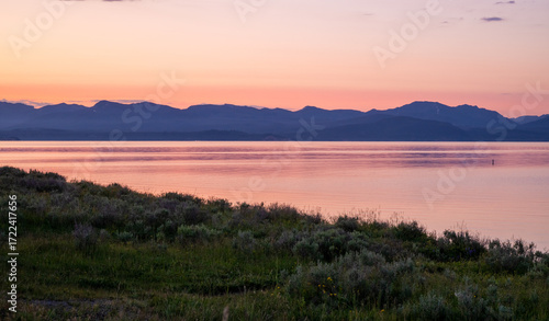 Fototapeta Naklejka Na Ścianę i Meble -  Silhouetted Mountains On The Distant Edge Of Yellowstone Lake