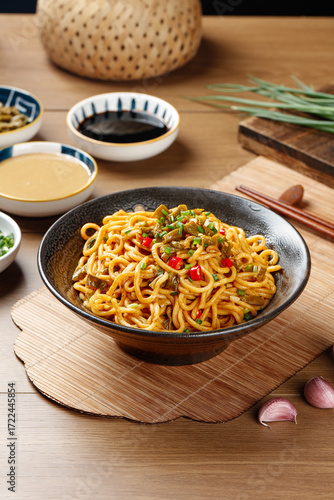 Wuhan Special Sesame Hot Dry Noodles with Sauce - Traditional Chinese Cuisine in Black Bowl