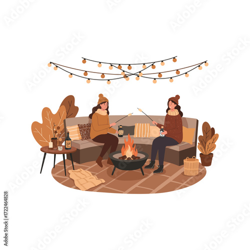 Two Women Roasting Marshmallows by a Cozy Outdoor Fire Pit with String Lights