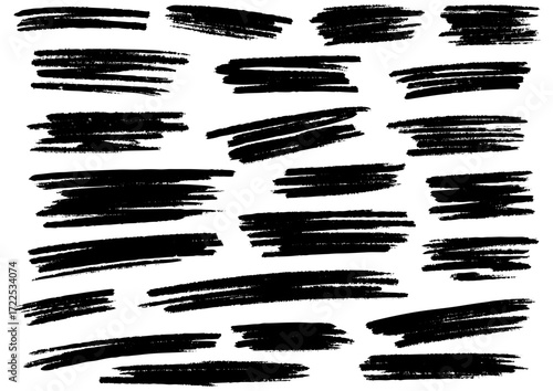 Collection of rough black ink brush strokes and scribbles on a white background, great for grunge design elements