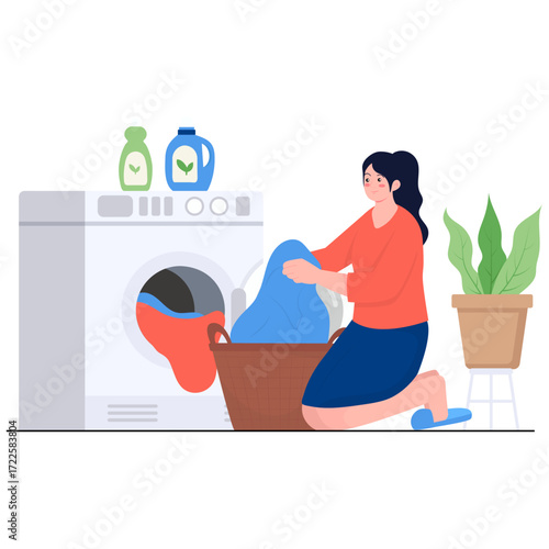 Woman folding laundry next to a washing machine