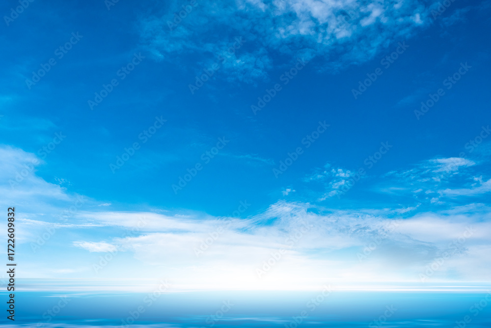 Fototapeta premium Nature of the ocean and blue sky Summer with sunshine, sandy beaches, clear blue waters sparkling against the blue sky. on an island with good ecology and environment Background for summer vacation