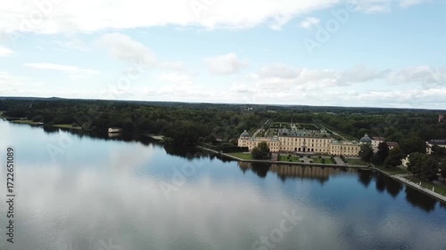 Drottningholm Palace aerial drone view, Stockholm Sweden, UNESCO World Heritage site with lake reflection, baroque architecture and scenic summer landscape