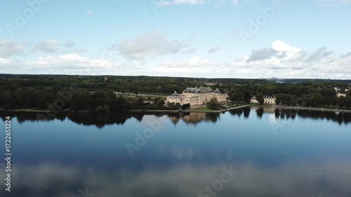 Drottningholm Palace aerial drone view, Stockholm Sweden, UNESCO World Heritage site with lake reflection, baroque architecture and scenic summer landscape